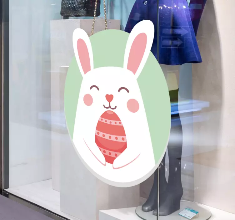 Sticker vitrine lapin mignon tenant un œuf - TenStickers