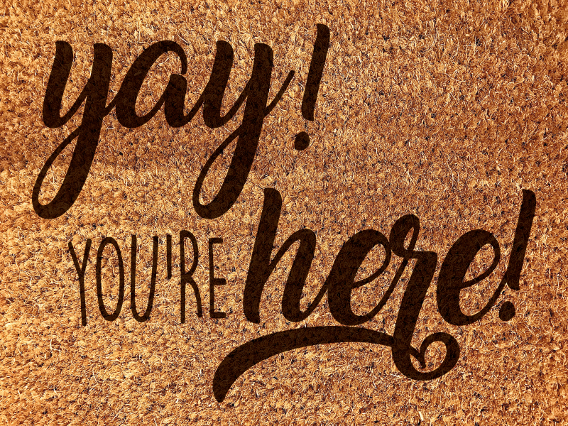 Tapis vinyle entrée phrase de bienvenue chaleureuse - TenStickers